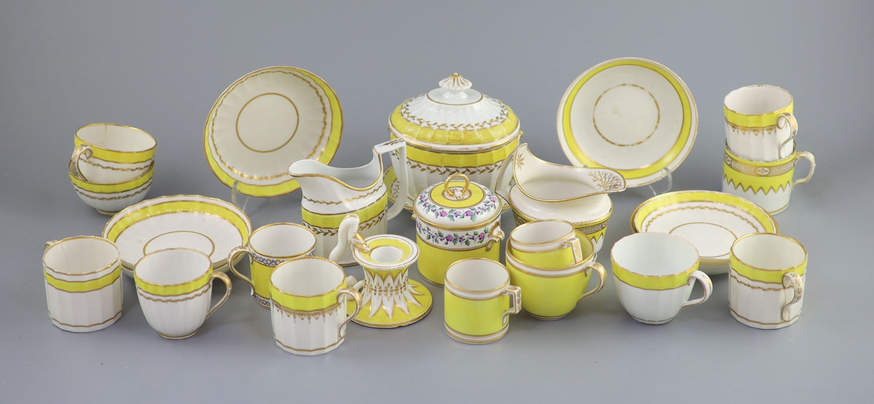 A group of Derby yellow ground tea and coffee wares and a chamberstick, c.1790-1800